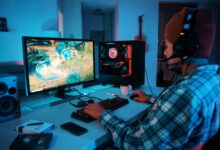 a person wearing headphones and using a computer