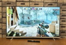 Television screen displaying a first-person shooter video game.