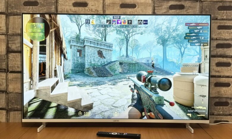 Television screen displaying a first-person shooter video game.