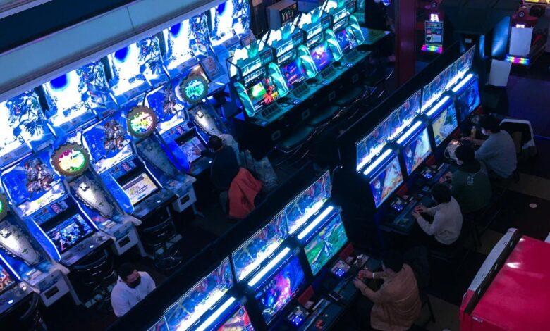 a group of people playing video games inside of a building