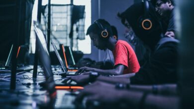 man playing on laptop